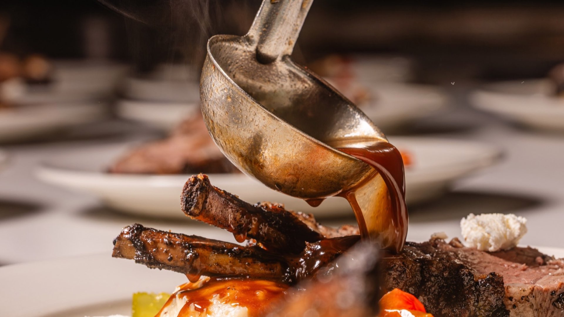 Chef plating food with warm cinematic lighting