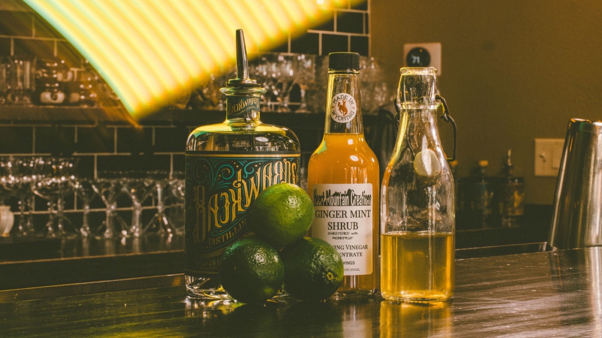 Wyoming craft spirits and ingredients arranged on a bar